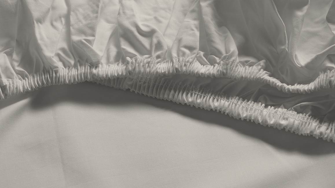 Snoozing percale katoen topper hoeslaken