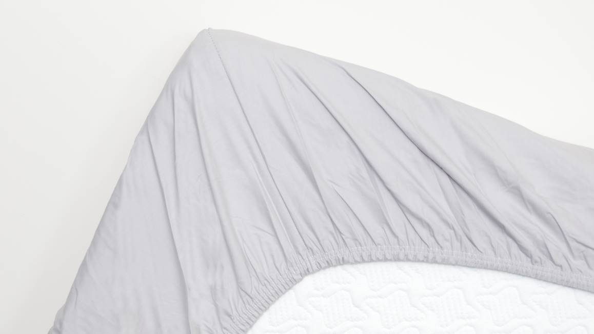 Snoozing percale katoen topper hoeslaken