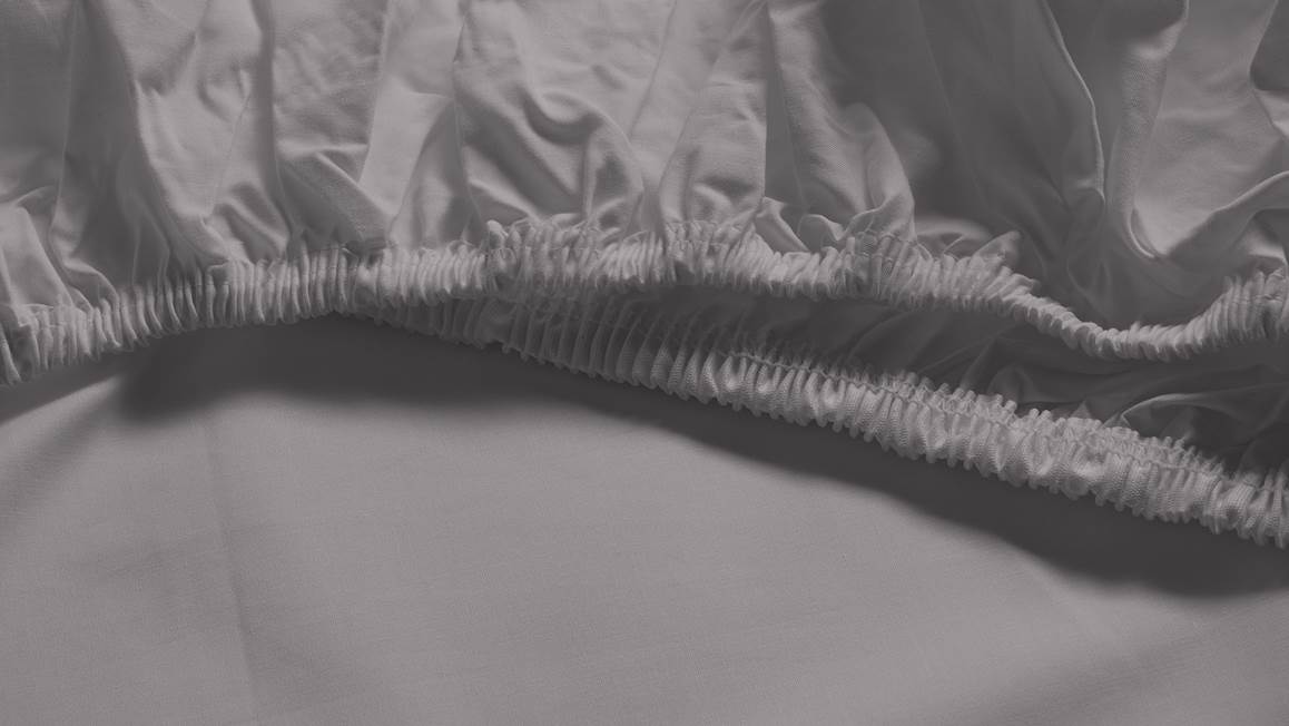 Snoozing percale katoen topper hoeslaken